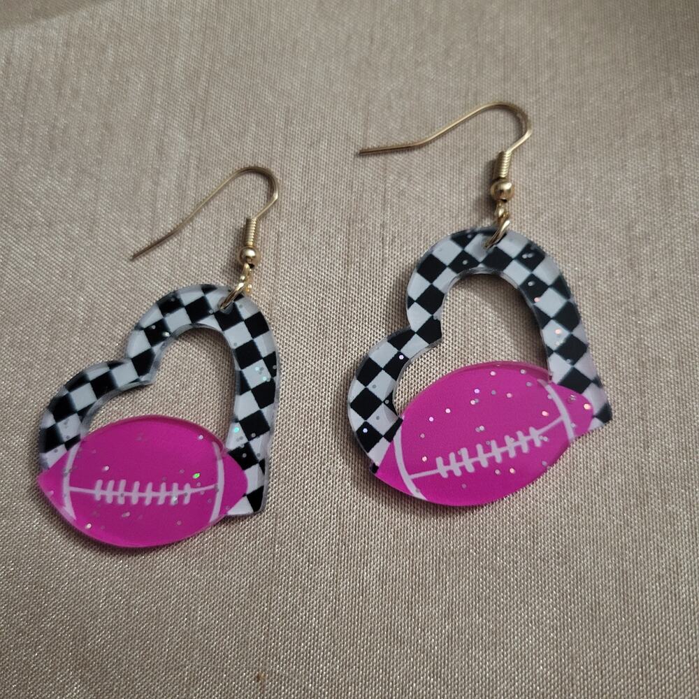 Pink football and checker board heart acrylic earrings